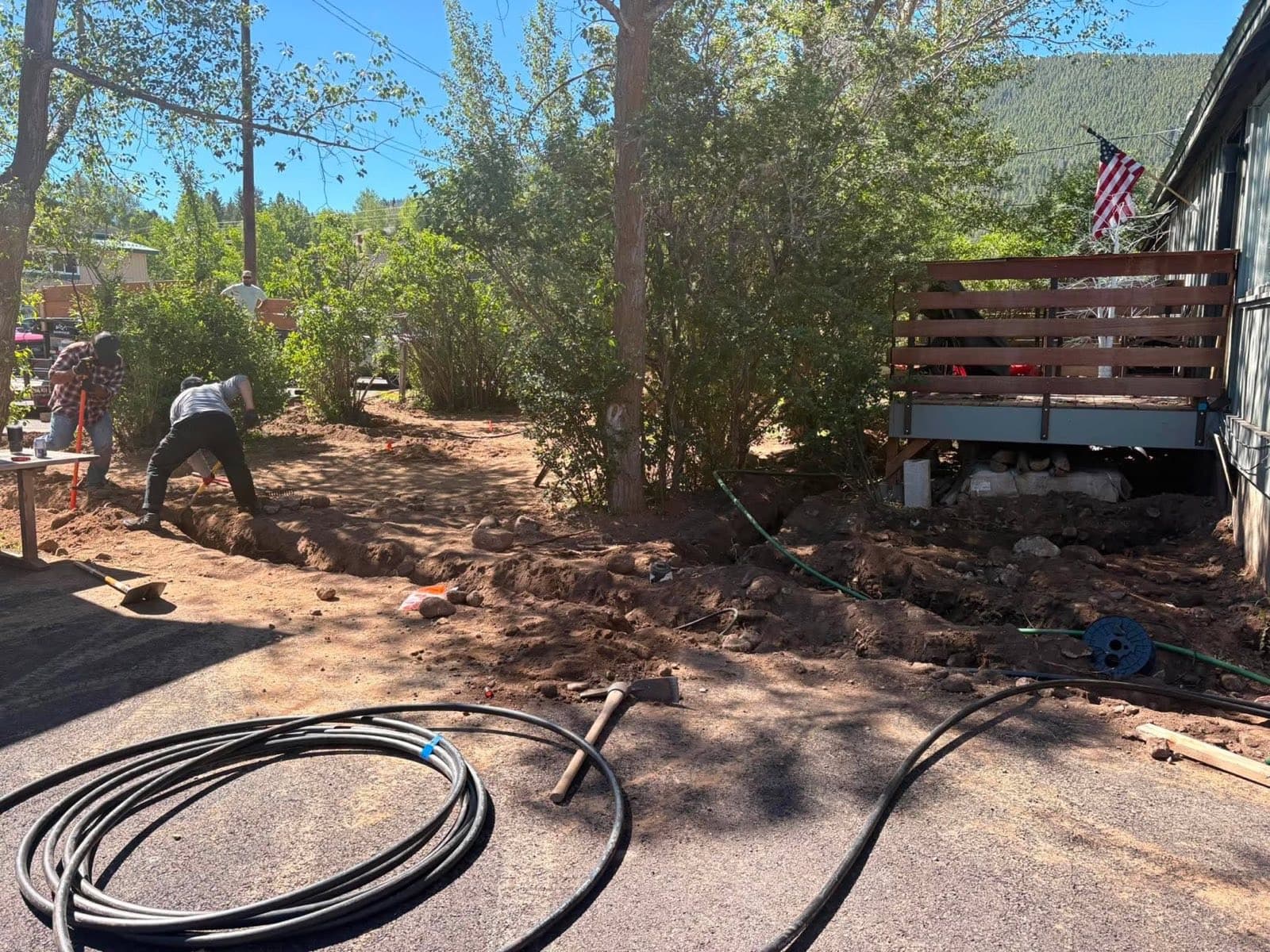 Stradley Landscape crew trenching for an irrigation install