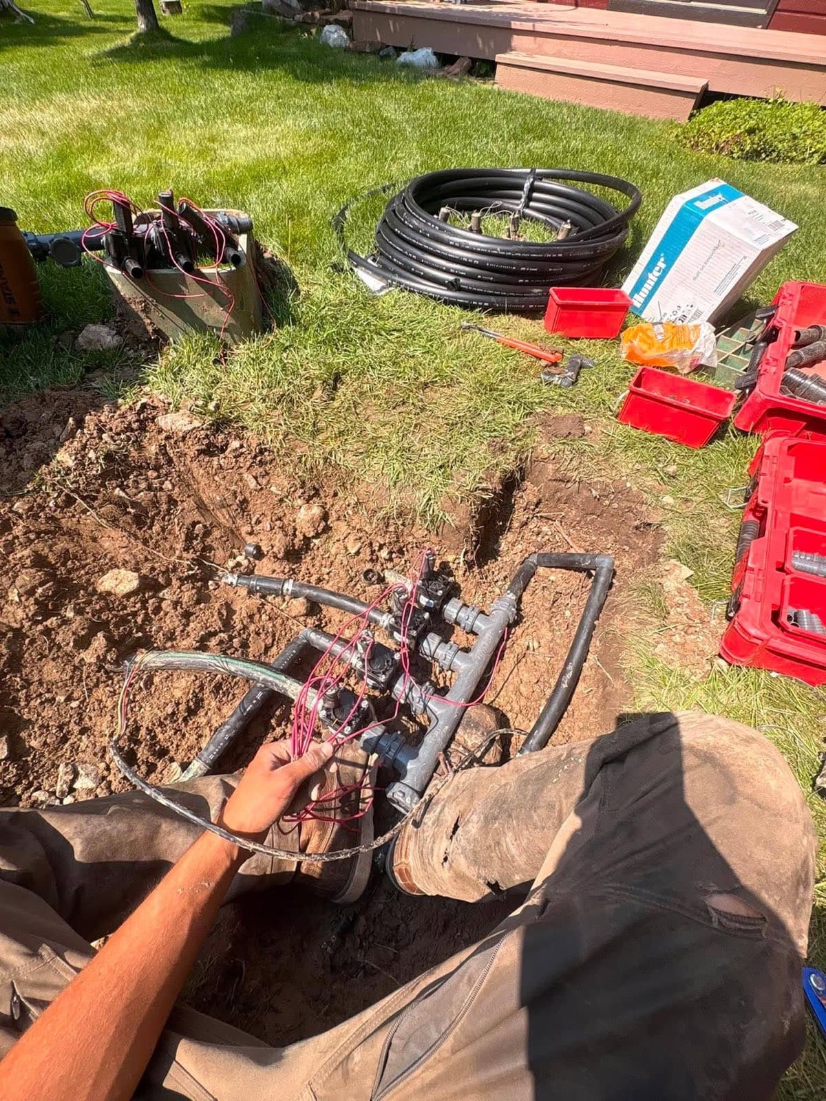 Irrigation valve manifold being installed in a Jackson Hole lawn